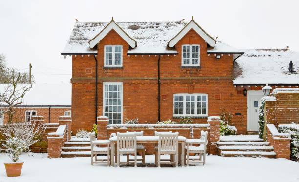 istock Heritage home and gardens in snow 1175292580