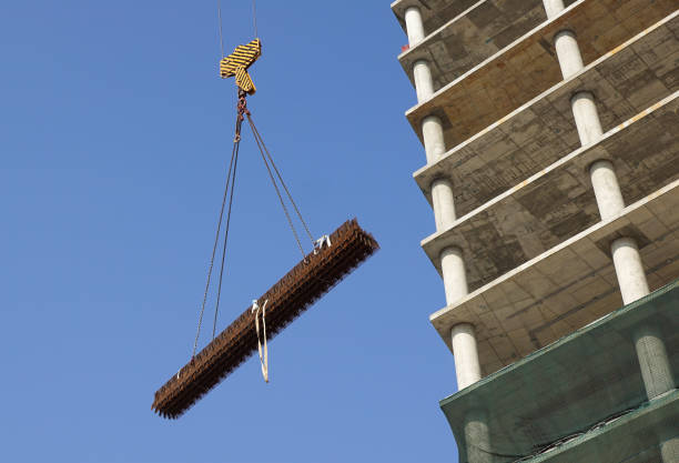 Closeup view of crane hook against blue sky