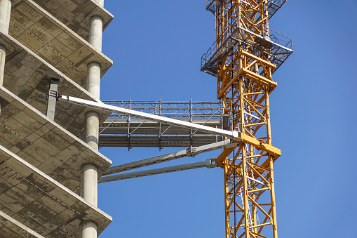 Look up at the messy work platforms and scaffolding on the construction site