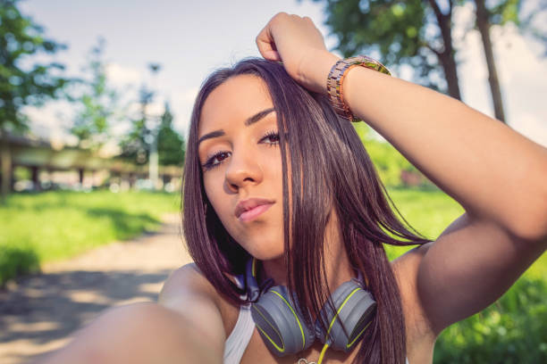 istock Happy girl walking on street 1175293801