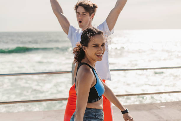 istock Young Couple Exercise Together By The Seaside 1175293824