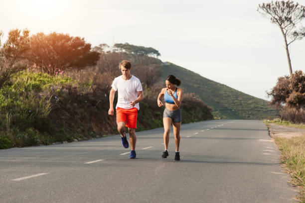 istock Young Couple Jogging Together 1175293997