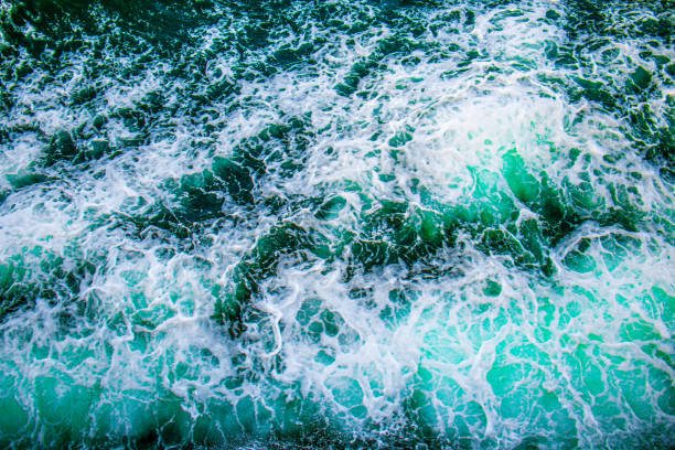 Waves from a ferry to an island