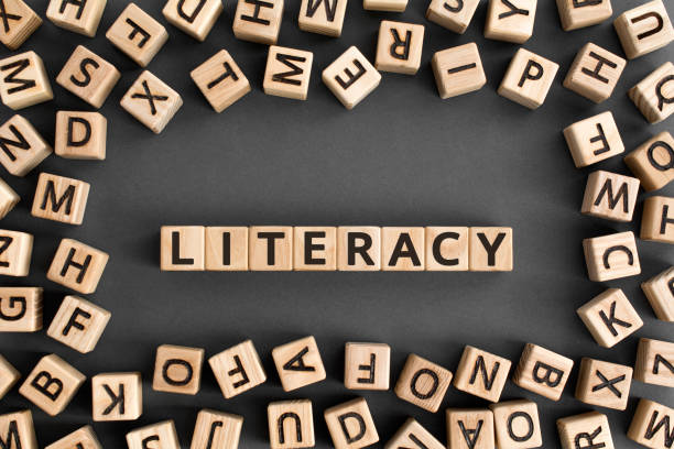 istock literacy - word from wooden blocks with letters 1175294285