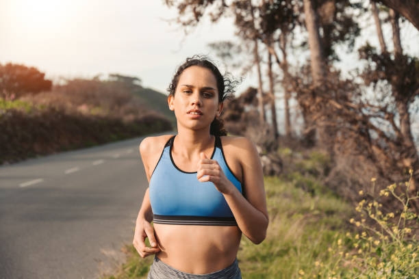 istock Female Athlete Running Outdoors 1175295433