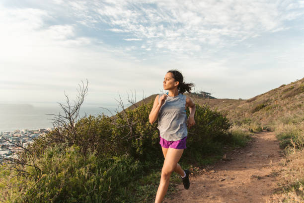 istock Female Athlete Running Outdoors 1175295697
