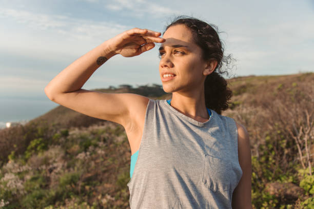 istock Young Female Athlete Looking At Sunset 1175295759