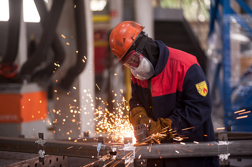 Tyumen, Russia - November 30, 2017: Man in workshop manufacturing metal in Mostootryad-36 Factory