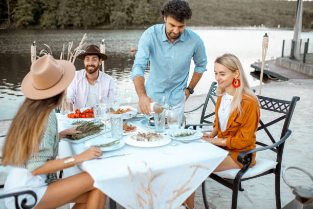 istock Friends dining on the beach 1175297266
