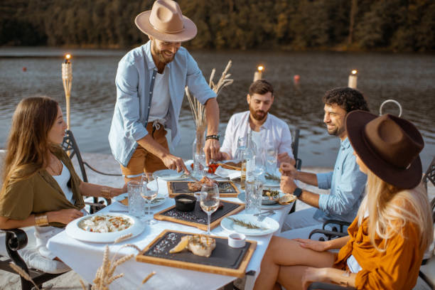 istock Friends dining on the beach 1175298204