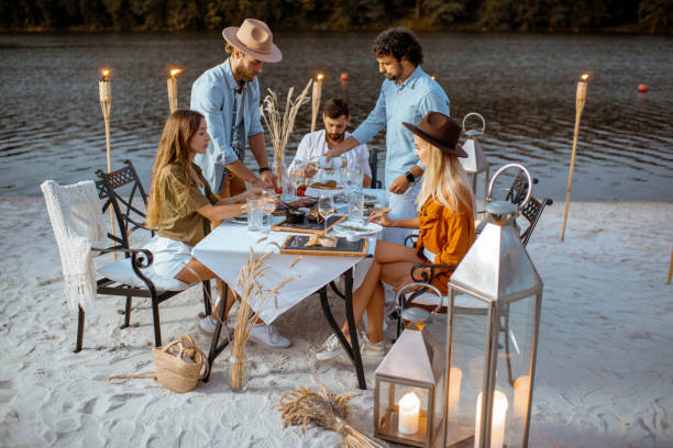 istock Friends dining on the beach 1175298212