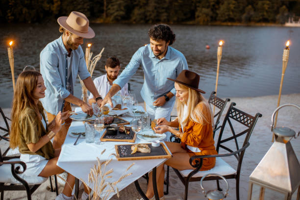 istock Friends dining on the beach 1175298238