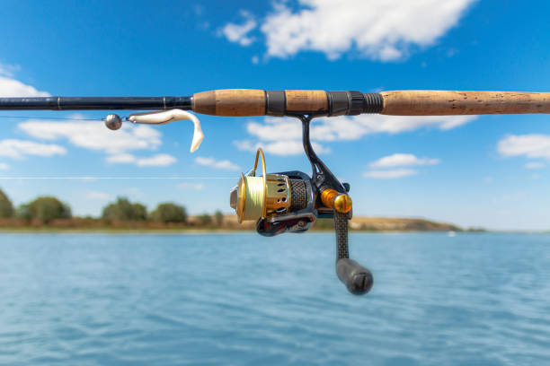 istock Spinning tackle against the background of the river. 1175298519