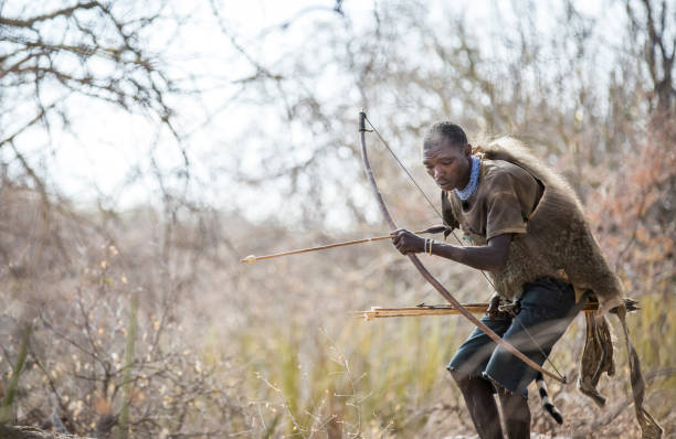 Lake Eyasi, Tanzania, 11th September 2019: Hadzabe hunter hunting for birds in the nature of northern Tanzania