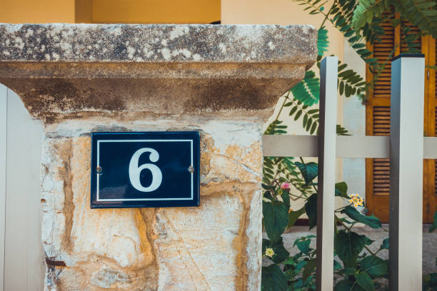 istock number 6 door sign on mediterranean facade 1175299565
