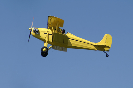 Yellow biplane in flight. Rhinehart-Rose Parrakeet A4-C. Built in 1978.