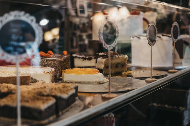 istock Cakes and desserts with on sale at a counter inside a cafe. 1175300343