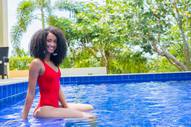 istock Woman sunbathing at a resort 1175300375