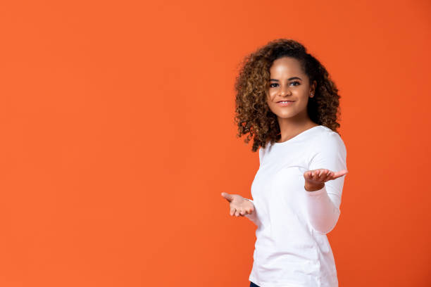 istock Happy African American woman doing welcome or presenting gesture 1175303269