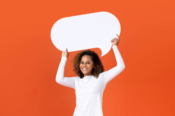 istock Young African American woman holding empty speech bubble 1175303358