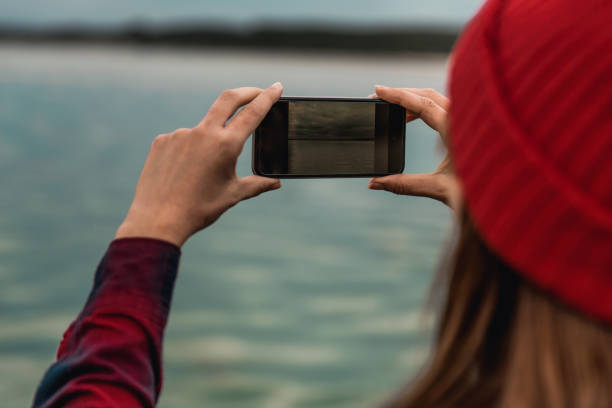 istock Woman taking pictures with a cellphone 1175303529