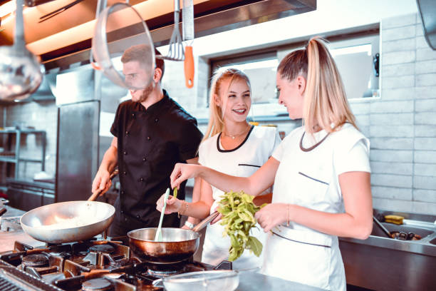 istock Kitchen Team Preparing Tasty Food 1175309182