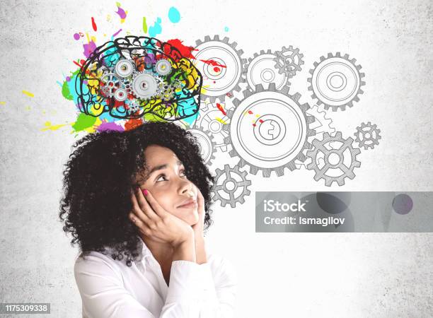 Thoughtful Young African Woman Brainstorming Stock Photo - Download Image Now - Contemplation, Creativity, Ideas