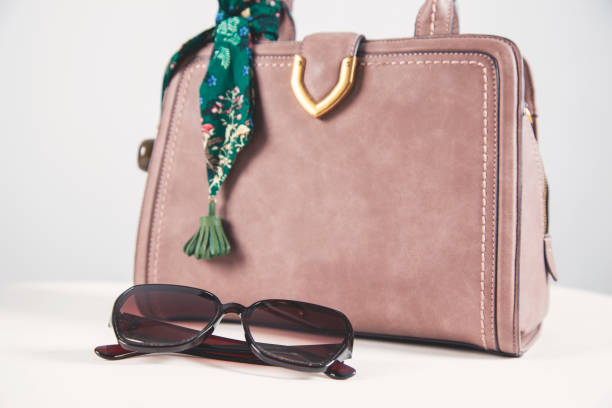 istock woman bag with sunglasses 1175309417
