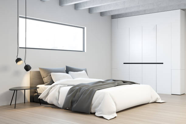 istock Corner of white master bedroom with wardrobe 1175309740