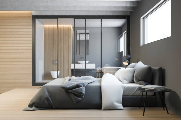 istock Side view of gray master bedroom with bathroom 1175309811