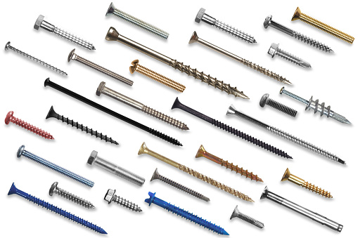 a collection of different screws on a background