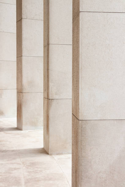 istock Light beige stone columns filling the frame 1175316288