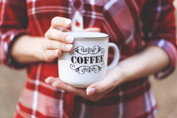 istock hands holding a Cup with the inscription coffee 1175316635