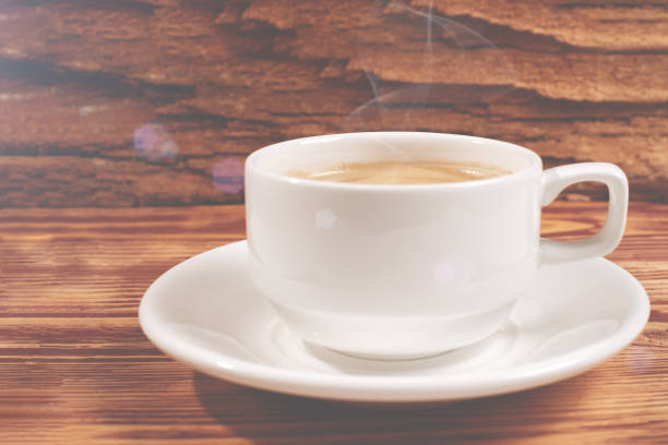 istock fragrant white Cup of cappuccino on wooden background 1175316706