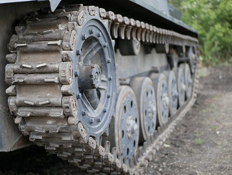 Close-up of tractor tracks on old equipment