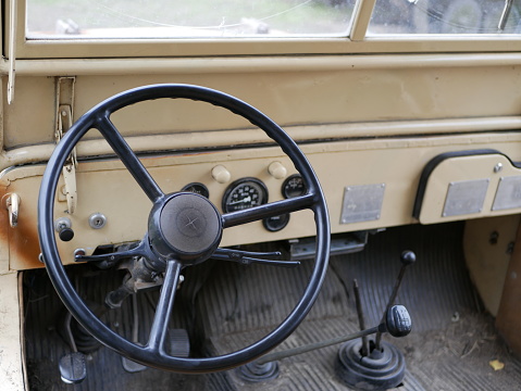 restored SUV world war II painted in camouflage. Military off-road vehicle. camouflage on military equipment. Ancient military equipment.