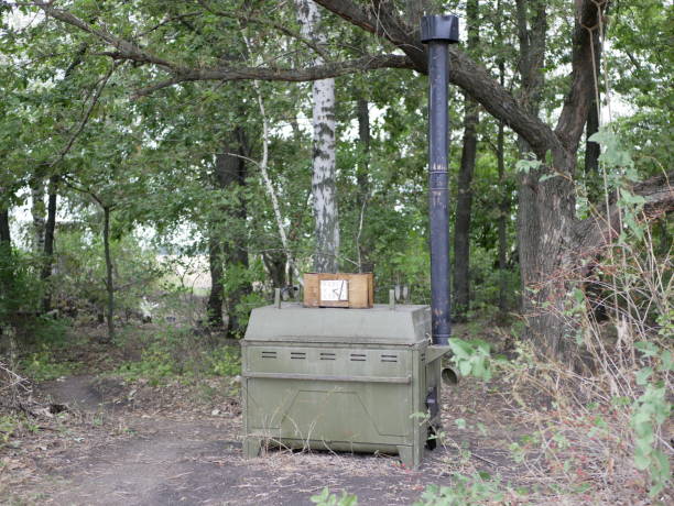 Military marching kitchen outdoors on a summer day on a leafy background .  world war II technology. Logistical support of troops.