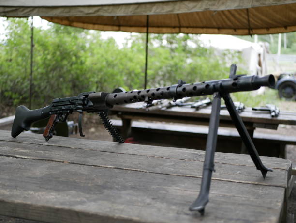 istock Samples of Soviet automatic weapons of the second world war. Machine guns and machine guns on a wooden table outside on a summer day. 1175319070