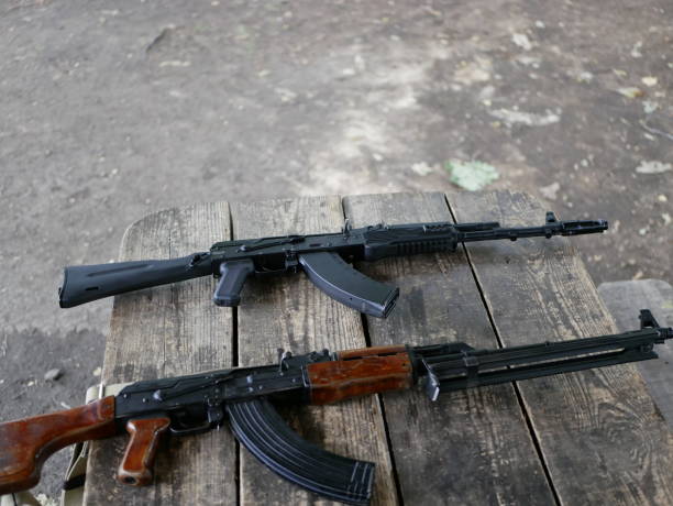 istock Samples of Soviet automatic weapons of the second world war. Machine guns and machine guns on a wooden table outside on a summer day. 1175319088