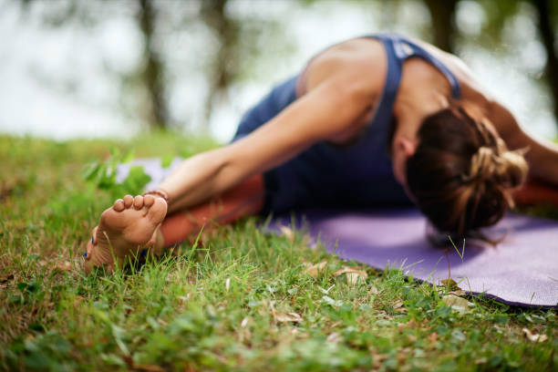 istock Woman doing exercsing yoga in nature. 1175319338