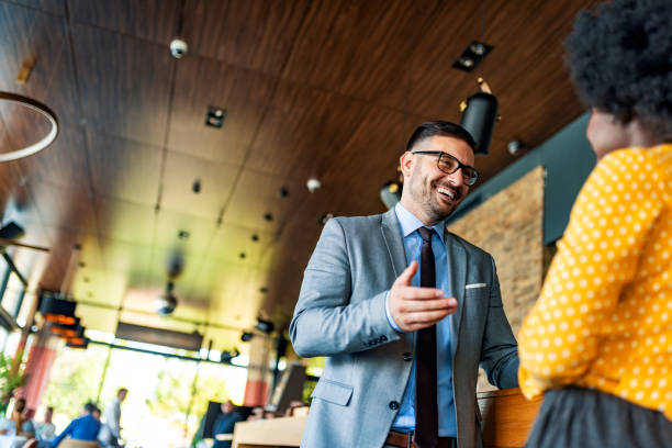 istock Cheerful young manager talking with new female employee 1175319432