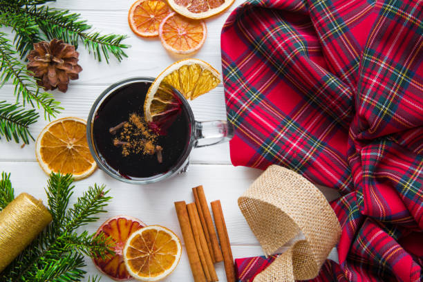 istock A cup of hot winter beverage and christmas check pattern plaid. 1175322943