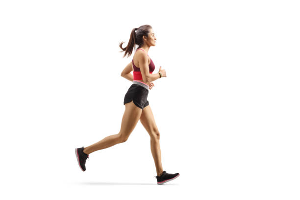 female athlete jogging - running women jogging profile imagens e fotografias de stock