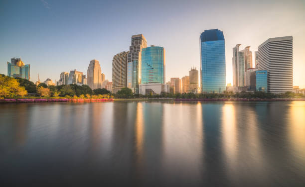 istock Lake in Public Park under Skyscrapers at Sunrise 1175325886
