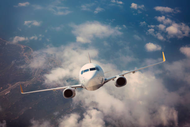 istock Passenger jet airplane flying above clouds 1175326147