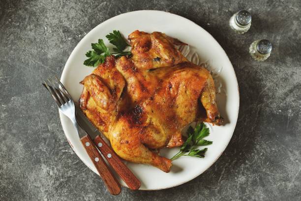 istock Spatchcocked barbecue chicken with spices and garlic 1175327252