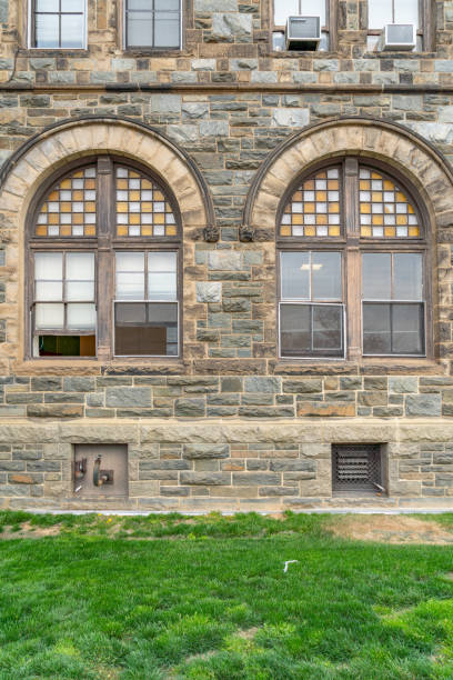 istock Old stone wall and windows of Church 1175327486
