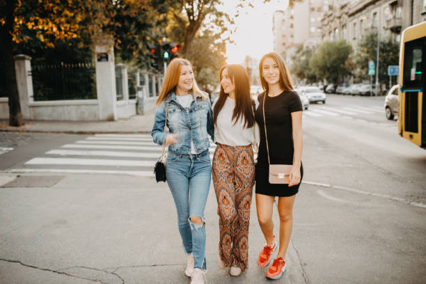 istock Three girls in the city using mobile maps 1175329916