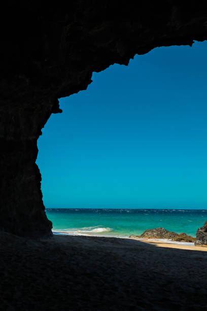Hanakapi'ai Beach by Lava tube cave, Kauai.