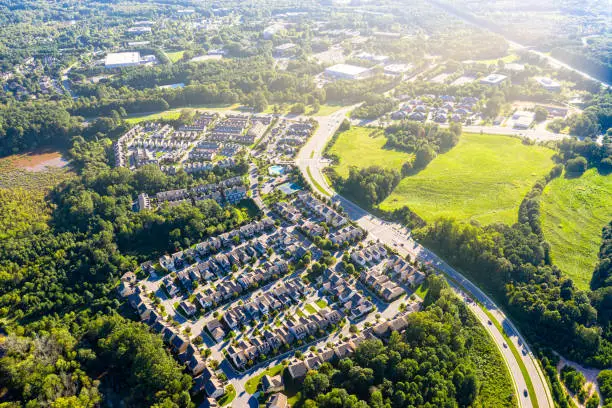 Aerial picture suburban gated community southern united states during sunset and sun rays